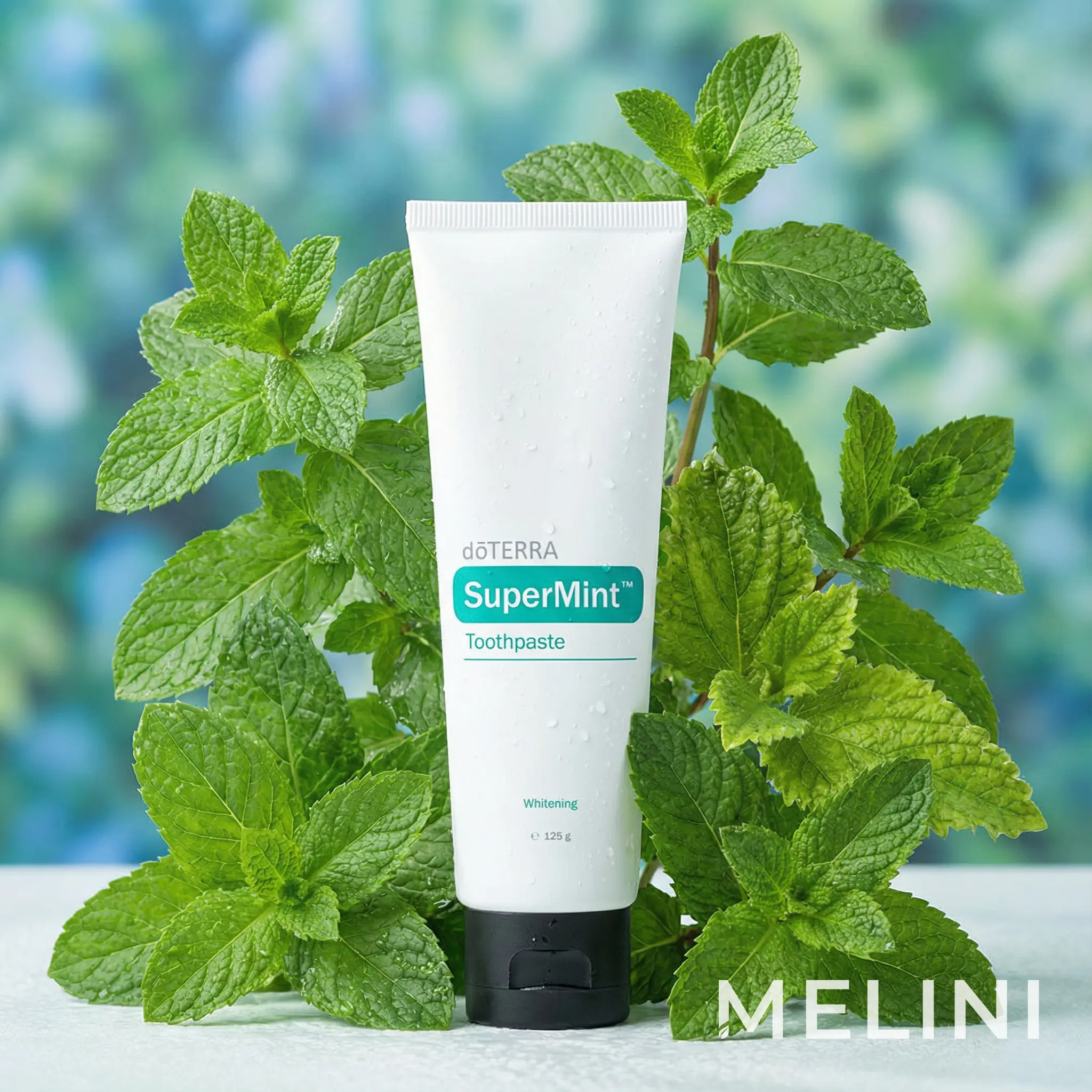 dōTERRA SuperMint Toothpaste — alternate view of the bottle and packaging